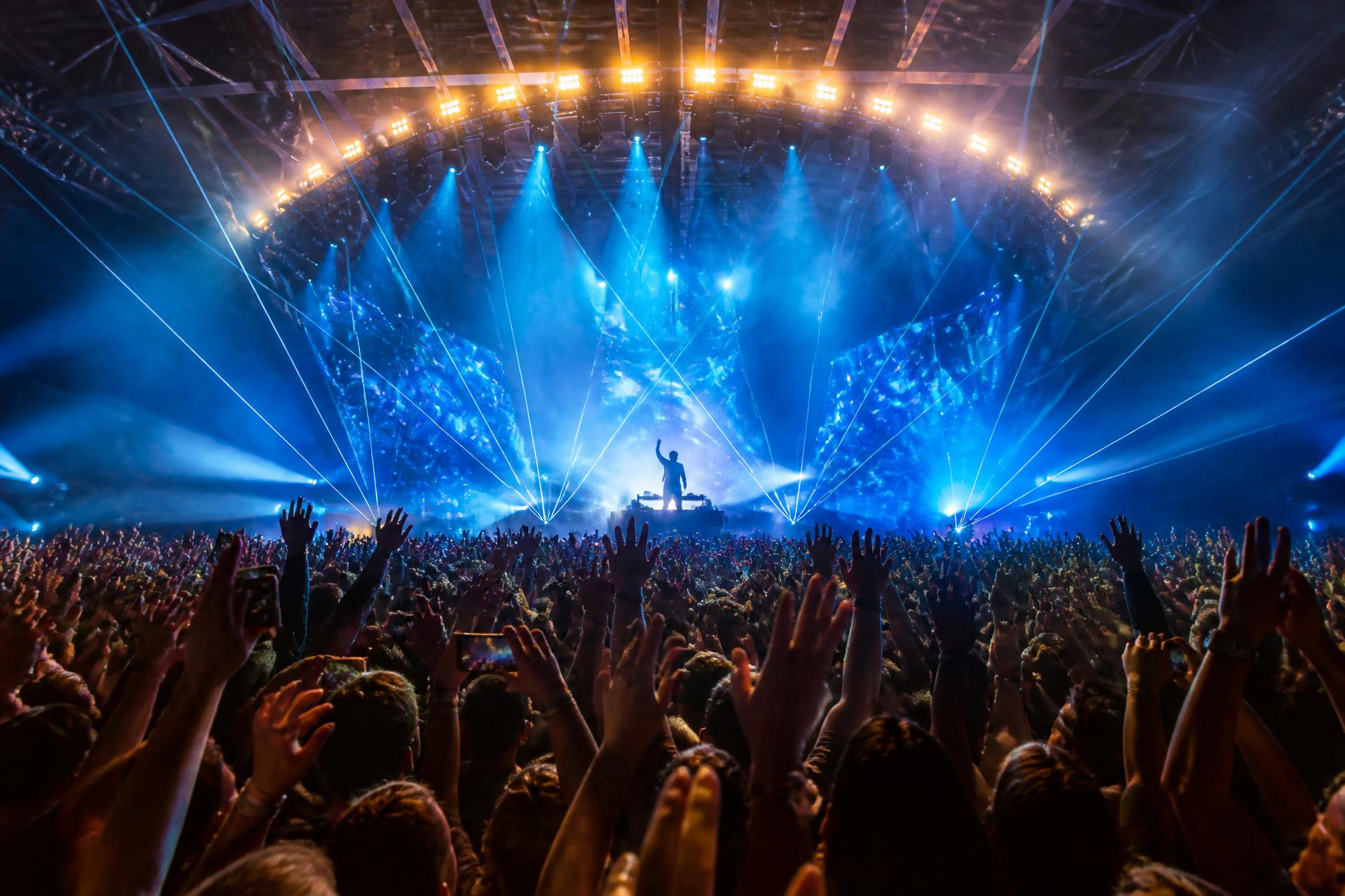 Live concert with crowd and stage lighting